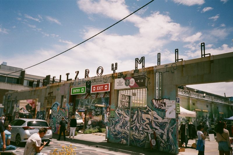 a group of people standing outside of a building