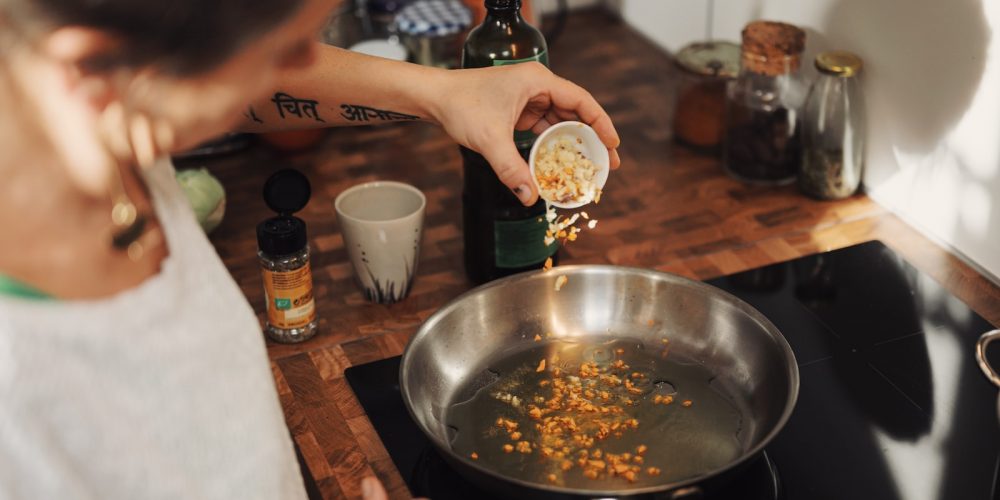 person holding stainless steel round tray with food