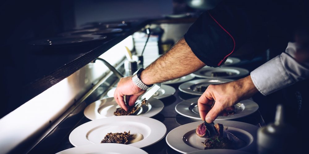 person preparing cooked dish