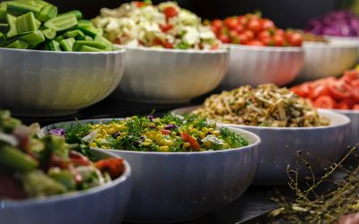 a group of bowls full of food