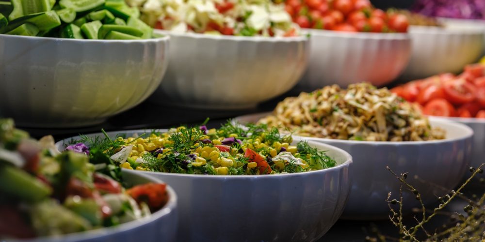 a group of bowls full of food